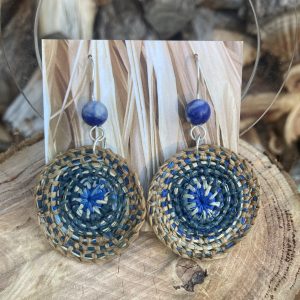 Indigo dyed hand-woven raffia earrings, hanging from hand-formed Argentium Silver hooks, with gemstones. Displayed on The Raffia Kat gift card