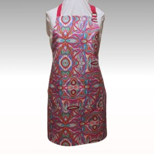Apron with hot pink neck and waist ties featuring Aboriginal art design